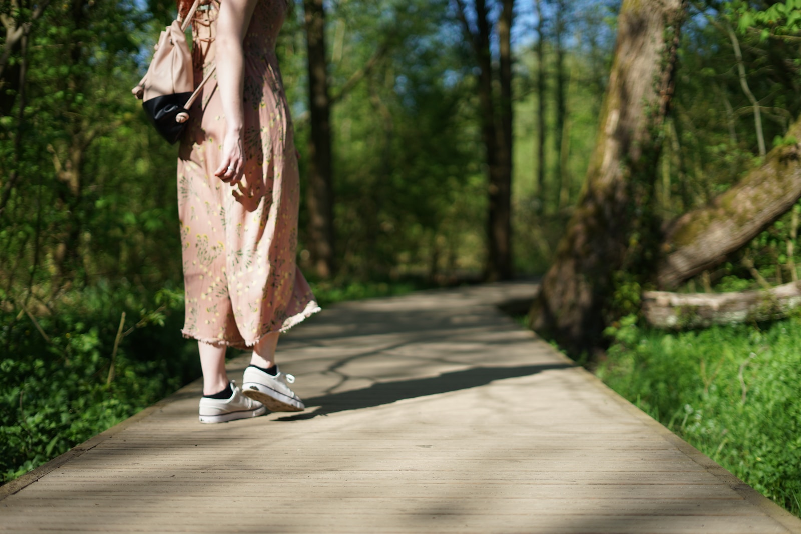 woman walking on forest trail